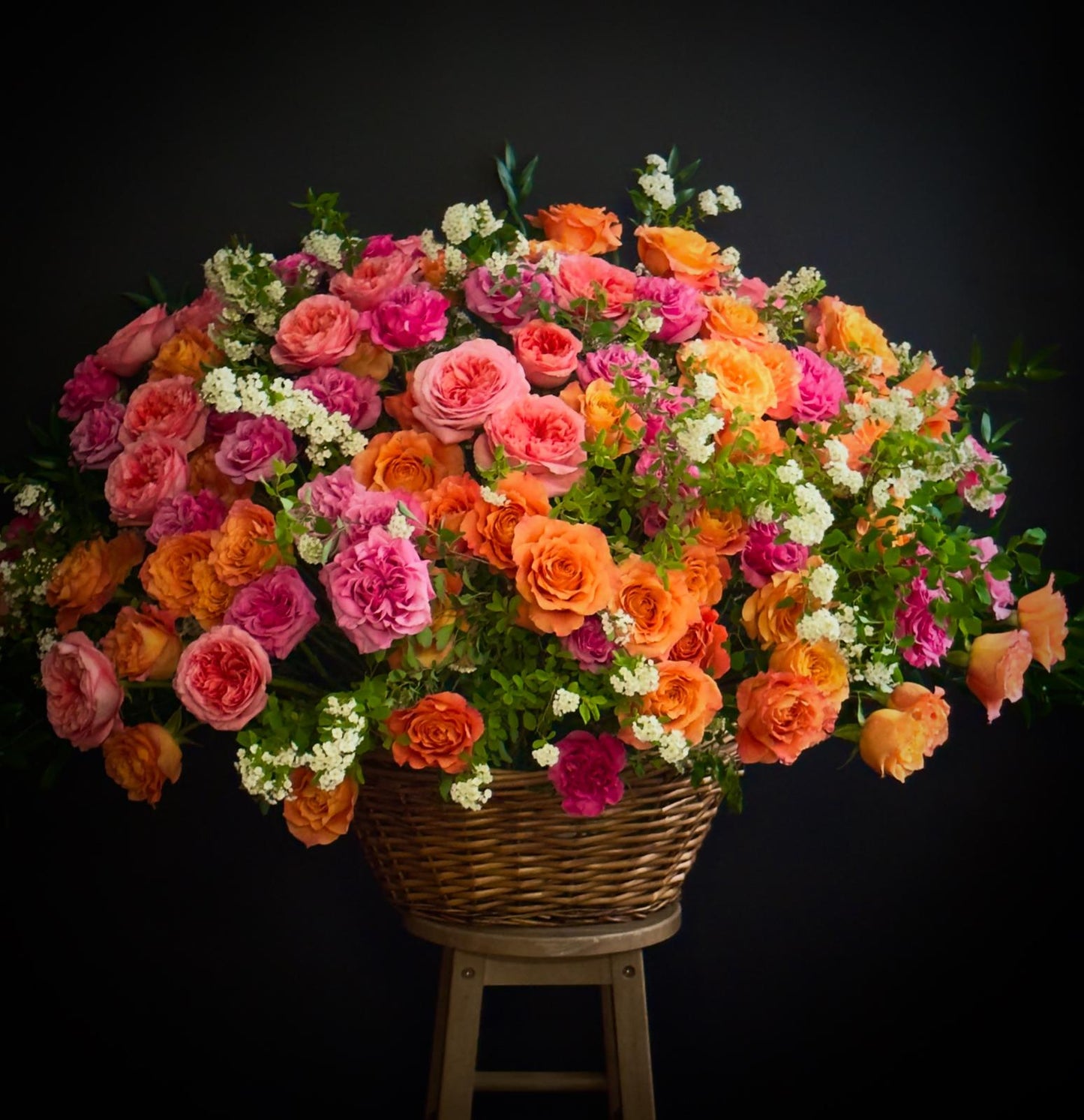 large joyful flower arrangement in basket 